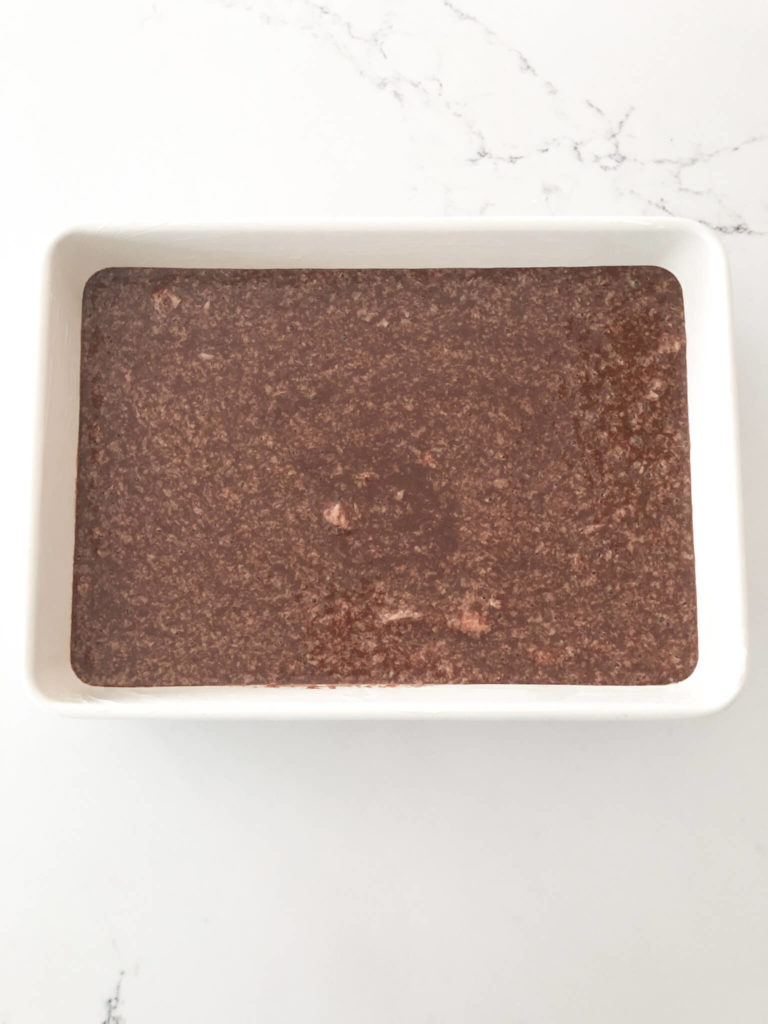 chocolate orange cake batter in a greased 9" x 13" baking dish