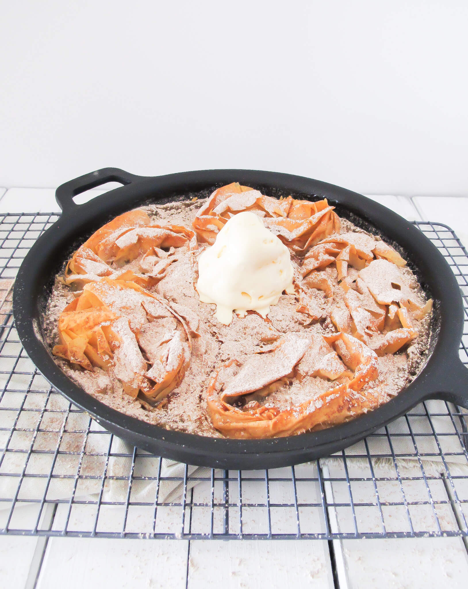 milk pie with curled phyllo sheets baked in a cast iron skillet