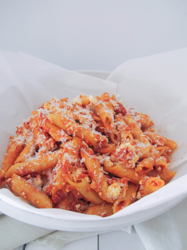 penne pasta in a bowl with pink pasta sauce