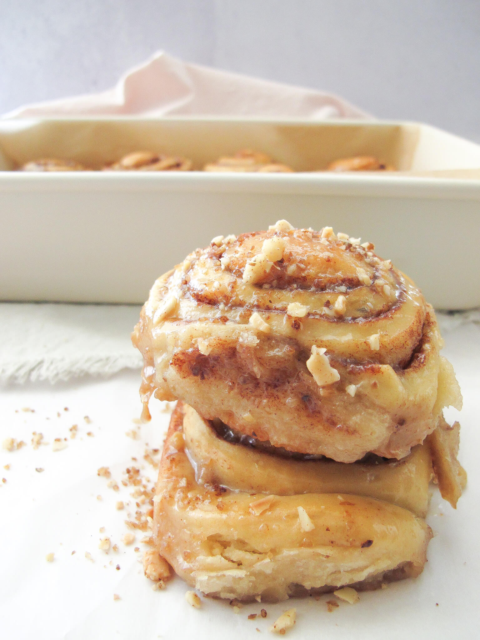 baklava cinnamon rolls with icing and ground walnuts and almonds