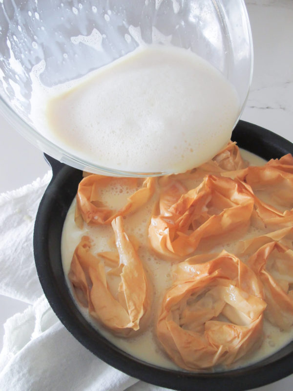 creamy milk pie filling poured over baked phyllo circles