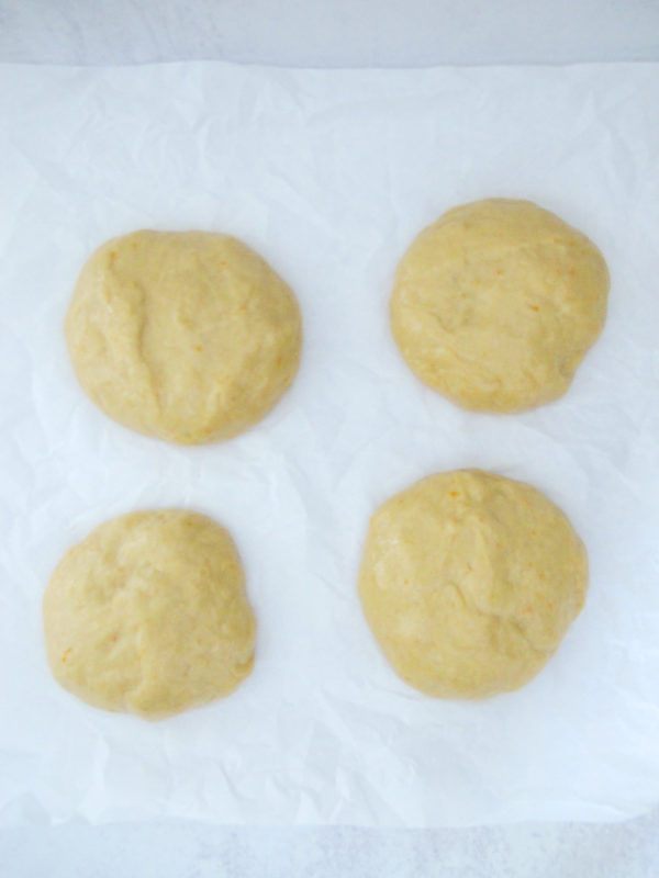 biscotti dough shaped into four medium size circles