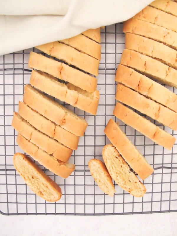 two loaves of lemon biscotti on a cooling rack