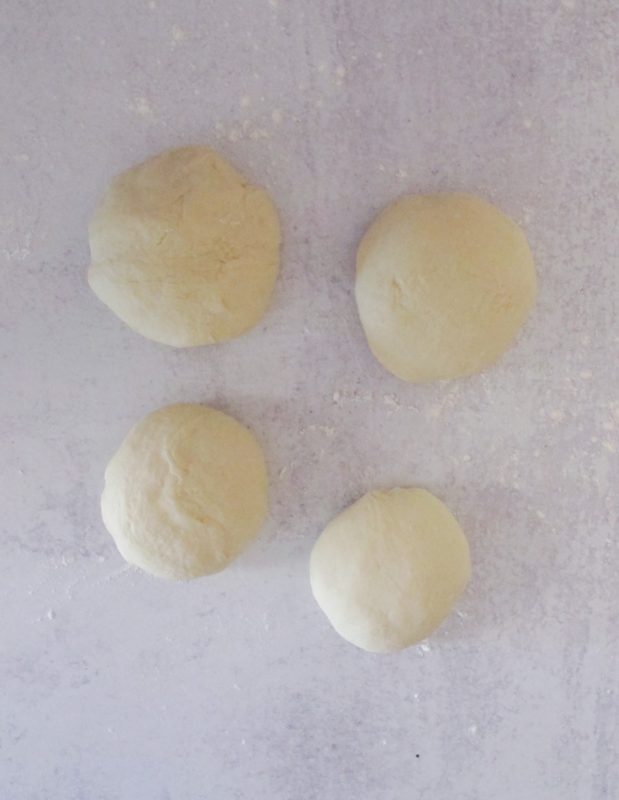 Four pieces of homemade phyllo dough balls.
