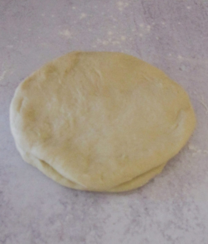 Two pieces of dough stacked on top of eachother.