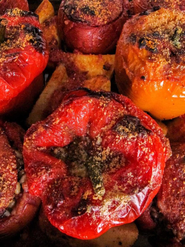 Greek stuffed peppers and tomatoes baked in the oven.