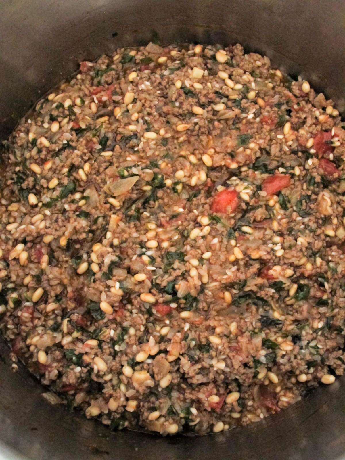 gemista filling of ground beef, rice, pine nuts, tomato juice, olive oil, and fresh herbs.