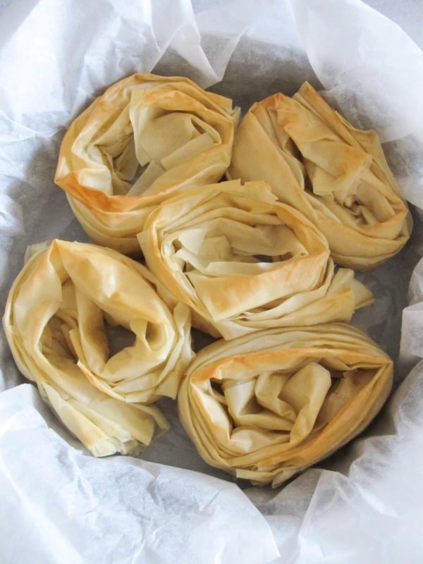 baked phyllo rolls in a baking pan.