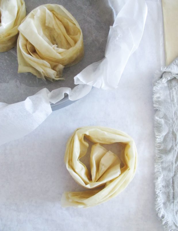 scrunched phyllo rolls in a baking pan.