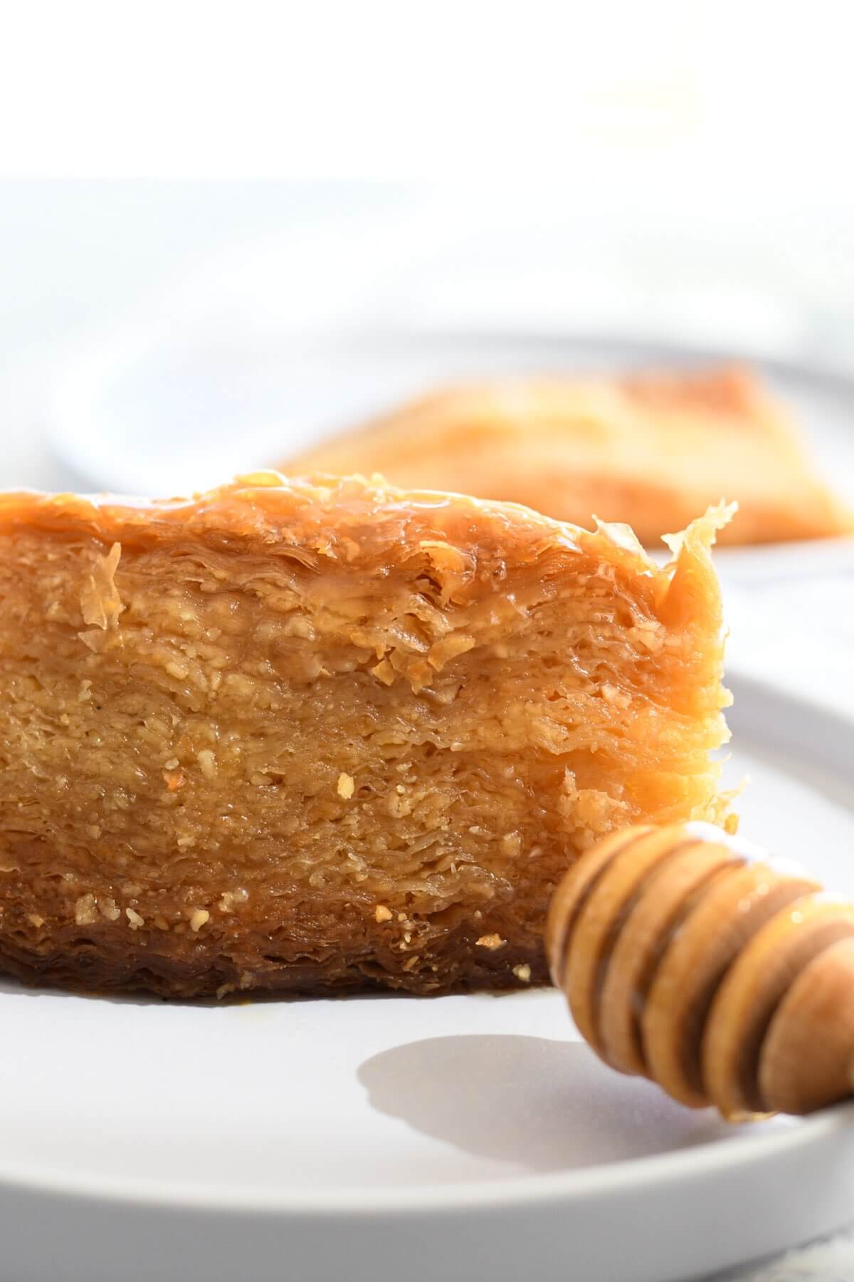 one piece of baklava on a white plate.