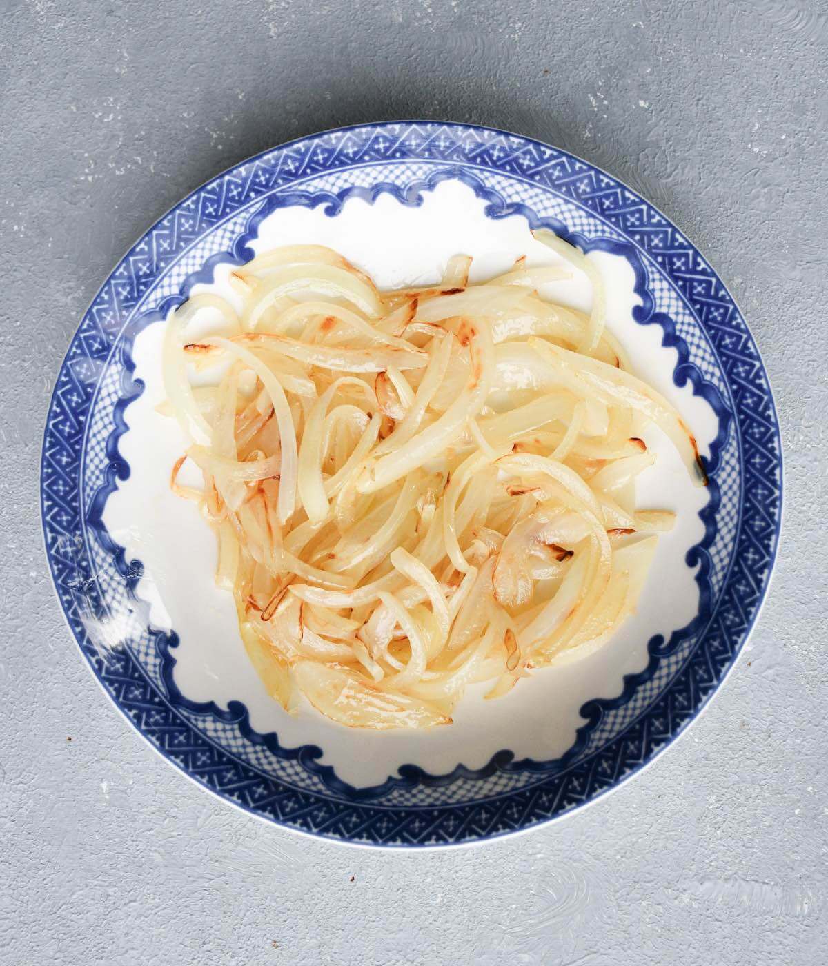 cooked sliced onions in a small bowl.
